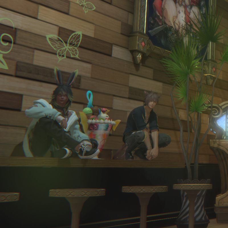 Two regulars sat up on the bar counter either side of an oversized parfait